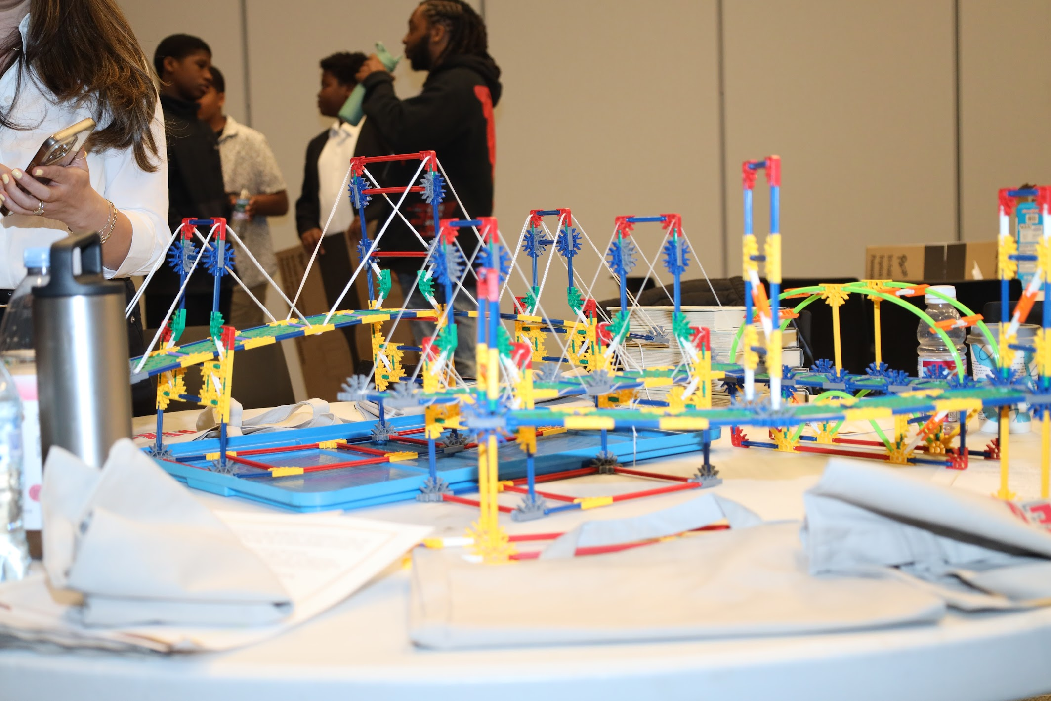 Students building bridge prototypes at the Bridging Brilliance 2025 showcase