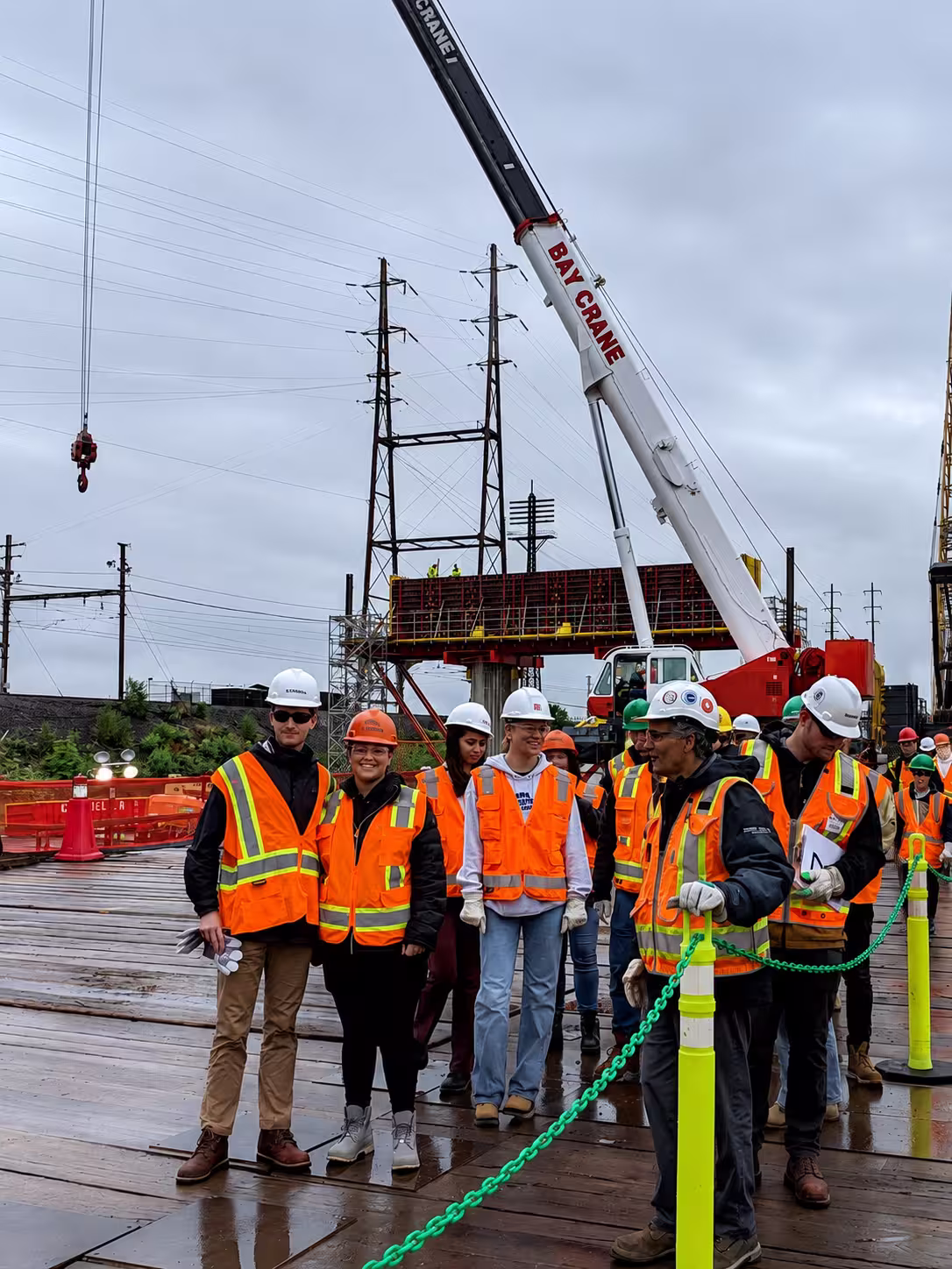 Rebuild scholars on a site visit to an active rail and bridge construction project