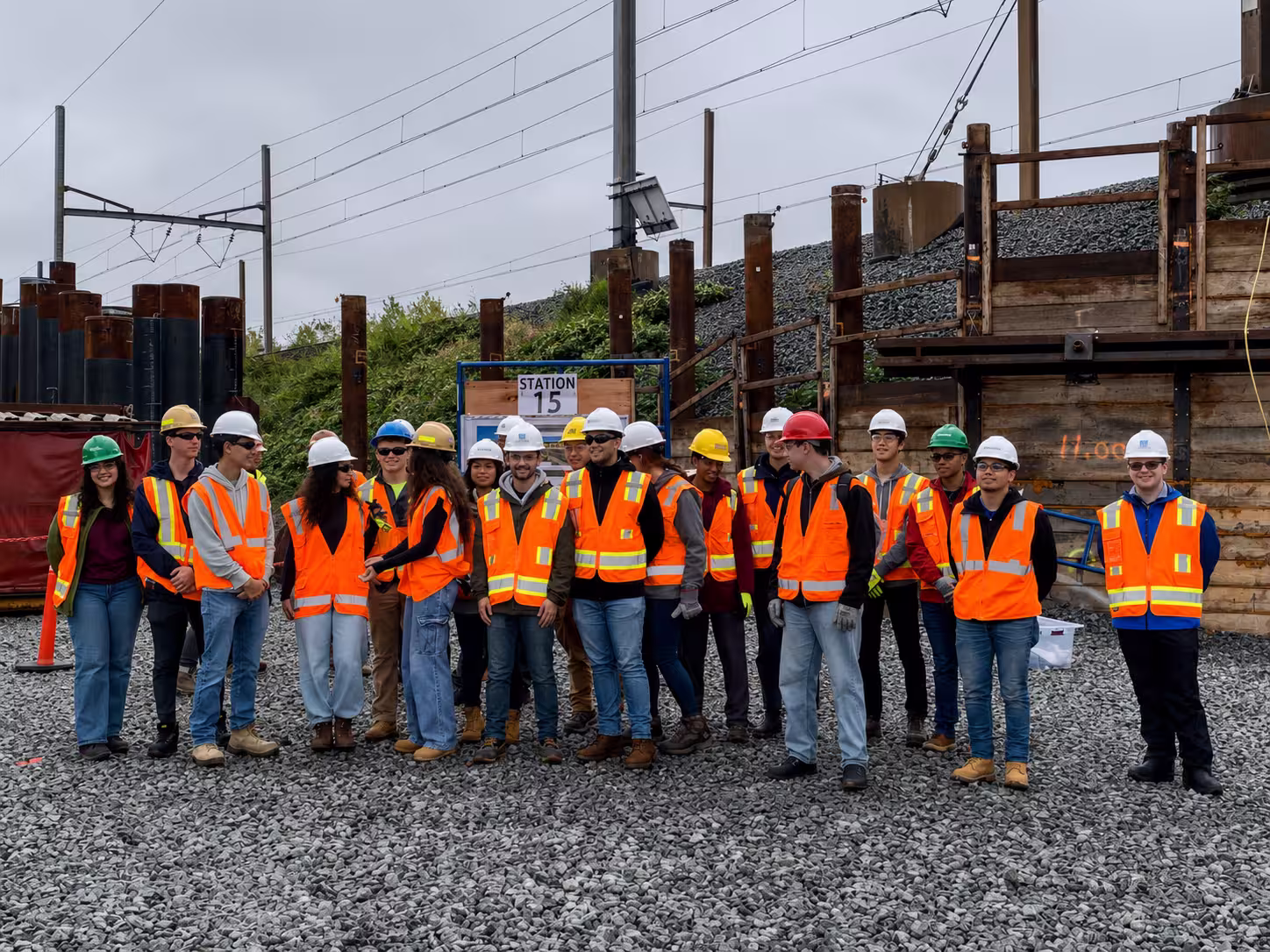 Vocational and trade program trainees on an active rail construction jobsite